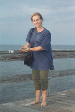 EVA IN ANNAPOLIS, MARYLAND: I love this photo of Eva beside the Chesapeake Bay, a gorgeous 1994 snapshot from Eva's German friend Wiebke Sander.   Wiebke tells me that "Eva is holding stones, seashells and smooth glass pieces from sand in her hand."  One of Eva's fans, Anne, commented, "I love this photo. It's very symbolic to me. It has Eva showing us her treasures!!! Her love and goodness burst from that picture."